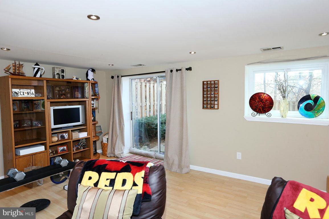 1816 Windjammer Way Gaithersburg, MD 20879 - Photo 22 of 29 a bedroom with furniture and a flat screen tv