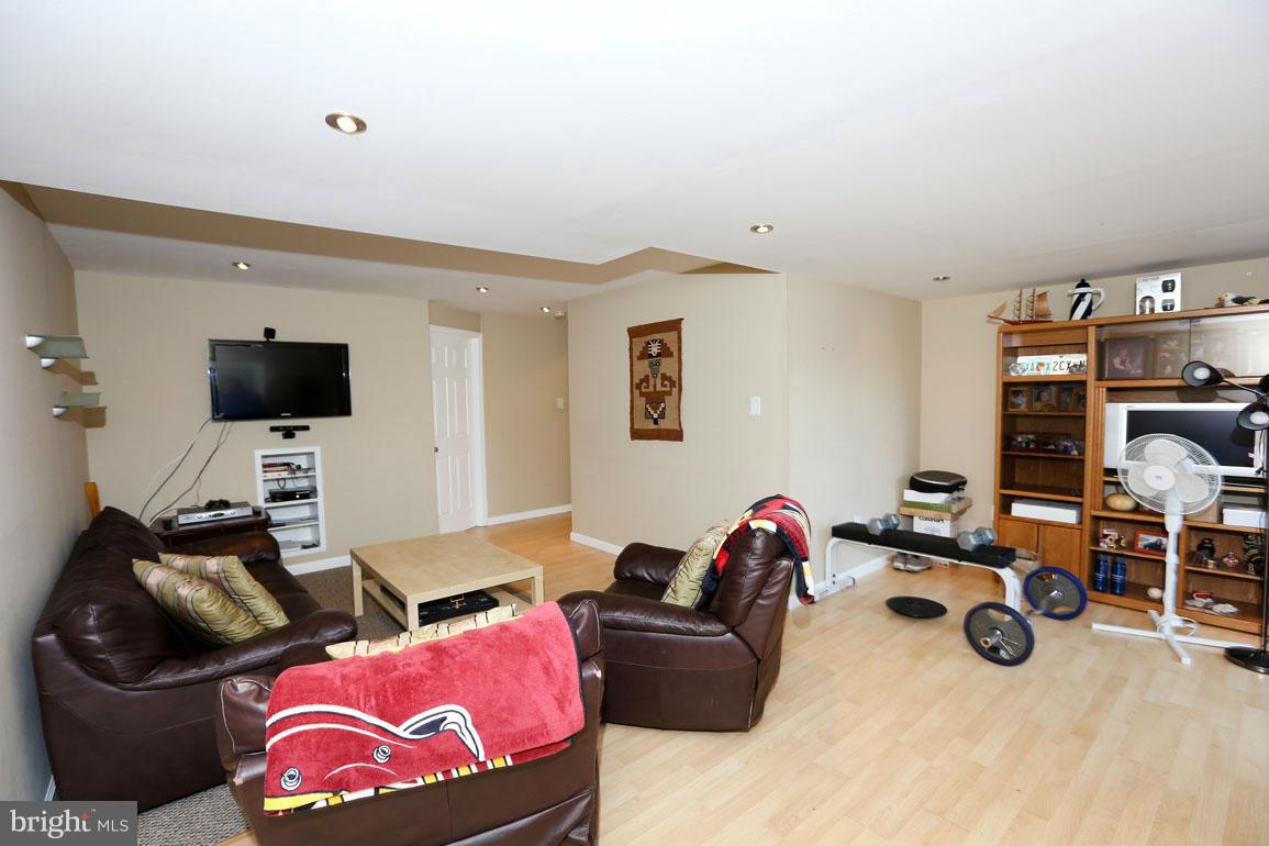1816 Windjammer Way Gaithersburg, MD 20879 - Photo 23 of 29 a living room with furniture and a flat screen tv