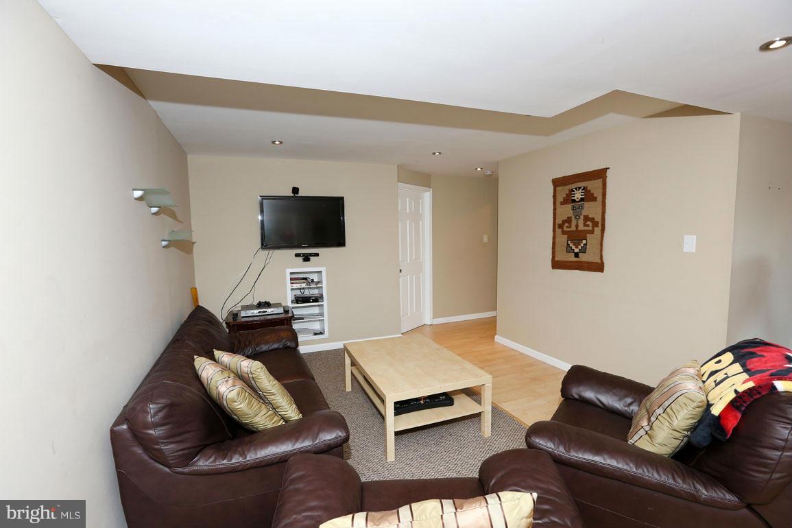 1816 Windjammer Way Gaithersburg, MD 20879 - Photo 24 of 29 a living room with furniture and a flat screen tv