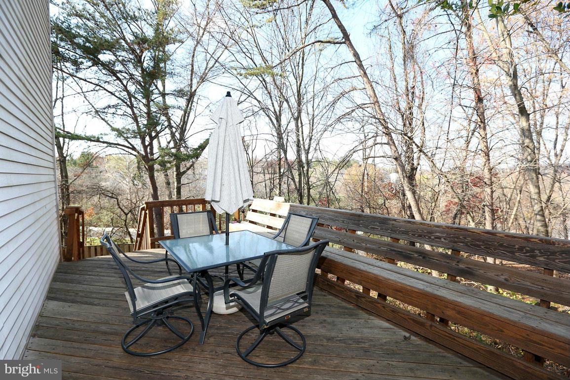 1816 Windjammer Way Gaithersburg, MD 20879 - Photo 26 of 29 a view of patio with table and chairs and wooden floor
