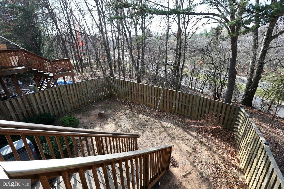 1816 Windjammer Way Gaithersburg, MD 20879 - Photo 27 of 29 a view of deck with a fence and wooden stairs