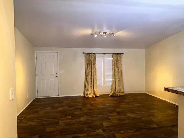 a bathroom with double sink and a mirror