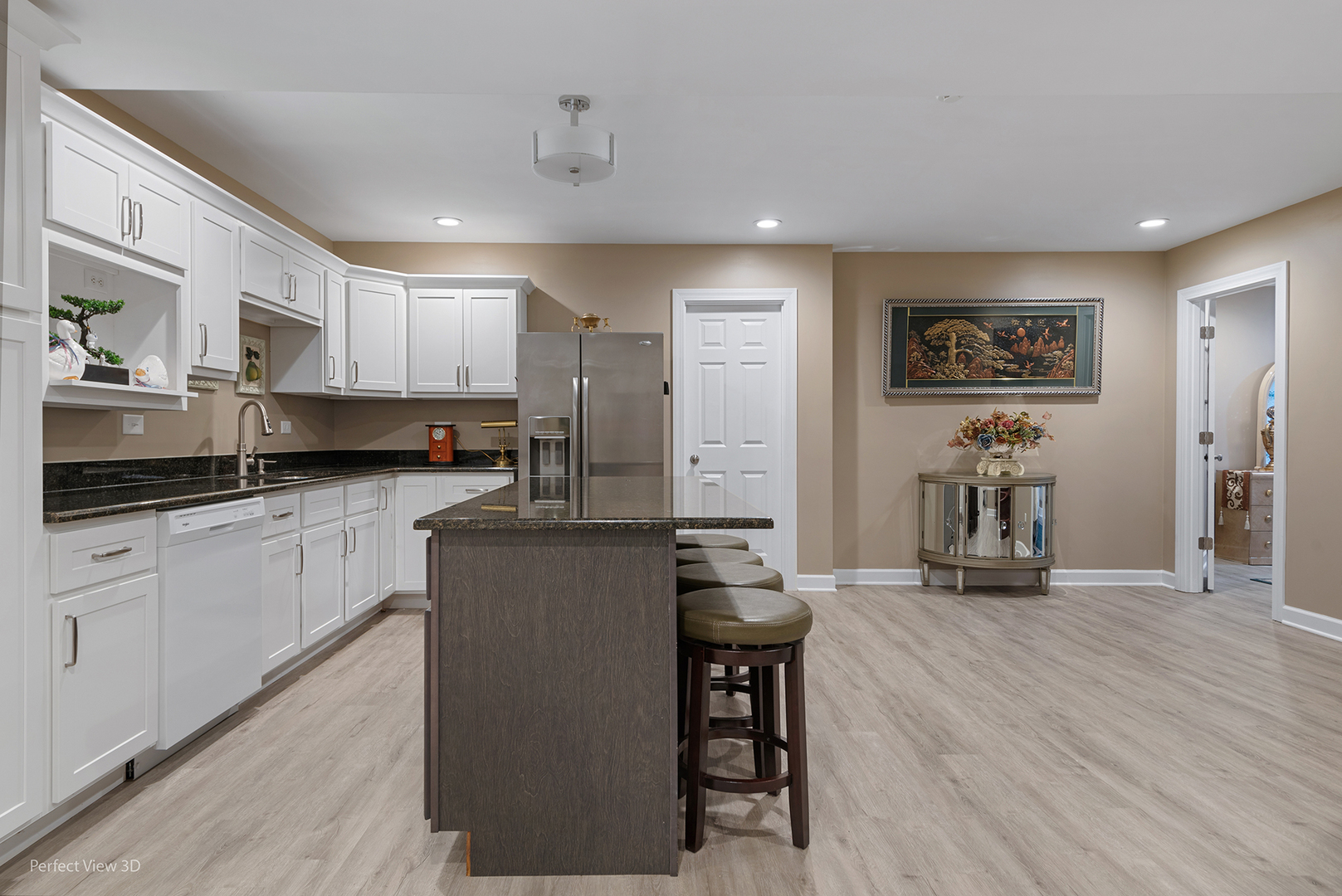 4611 Corktree Road Naperville, IL 60564 - Photo 18 of 20 a kitchen with stainless steel appliances a refrigerator a sink a stove and white cabinets with wooden floor