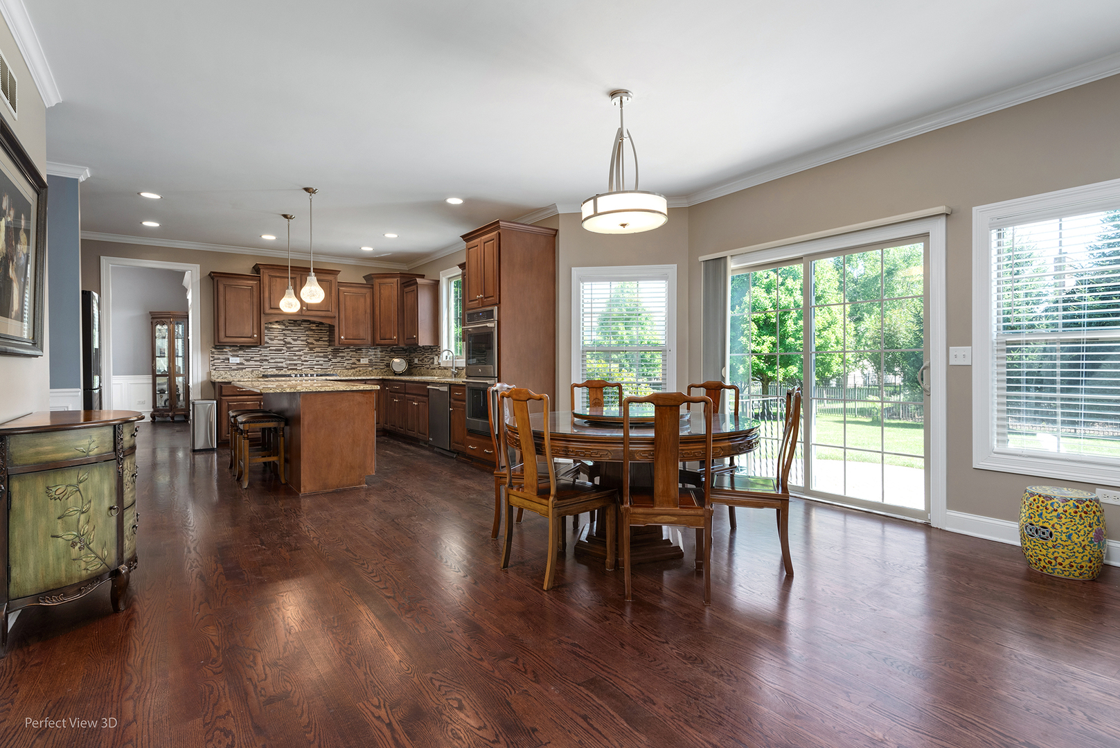 4611 Corktree Road Naperville, IL 60564 - Photo 7 of 20 a view of a dining room and livingroom with furniture wooden floor a chandelier