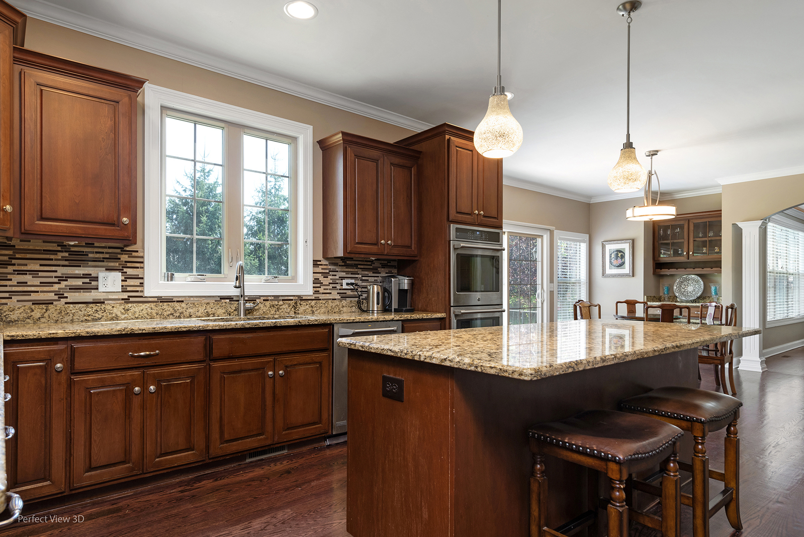 4611 Corktree Road Naperville, IL 60564 - Photo 9 of 20 a kitchen with granite countertop a sink appliances and cabinets