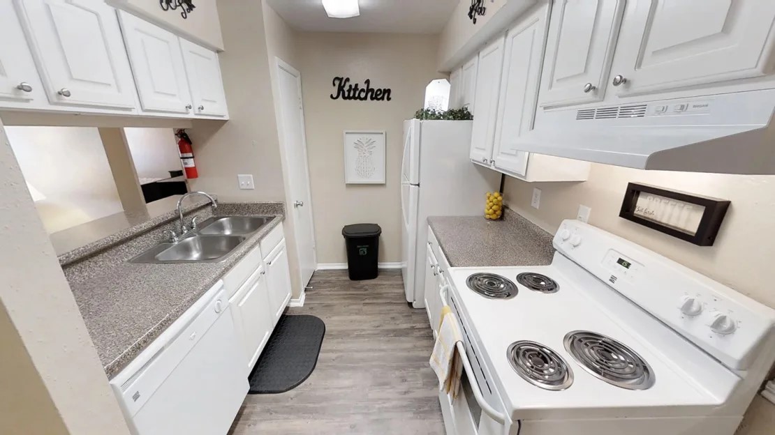 515 South Bender Avenue, Unit 2008 Humble, TX 77338 - Photo 17 of 17 a kitchen with a stove and a refrigerator