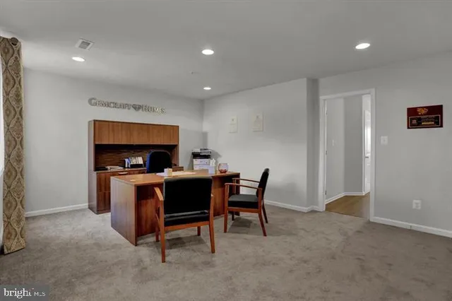 a view of a workspace with furniture