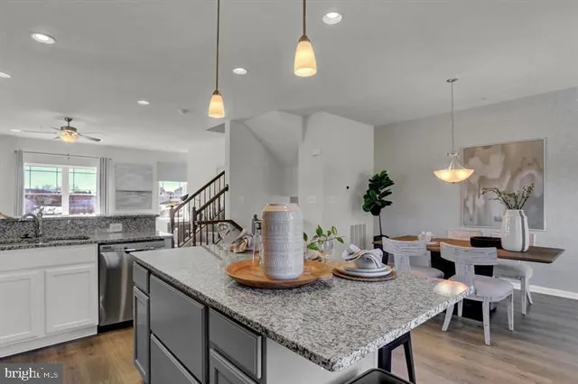 a kitchen with a table and chairs in it