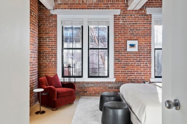 a bathroom with a tub sink and glass door