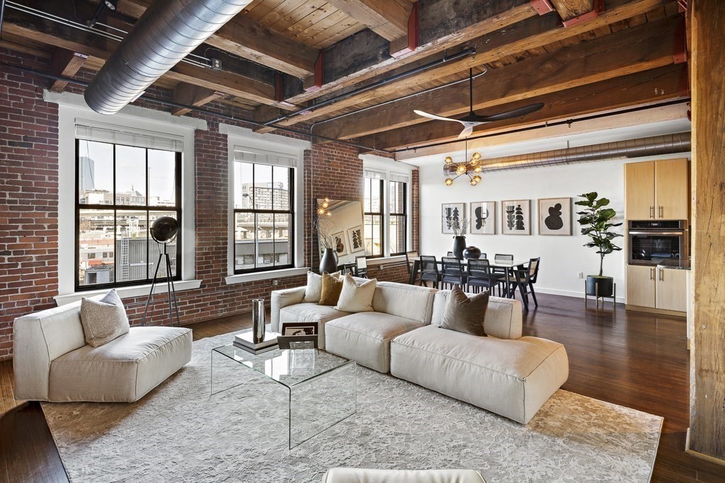 9 West Broadway, Unit 312 Boston, MA 02127 - Photo 2 of 35 a living room with furniture and a large window