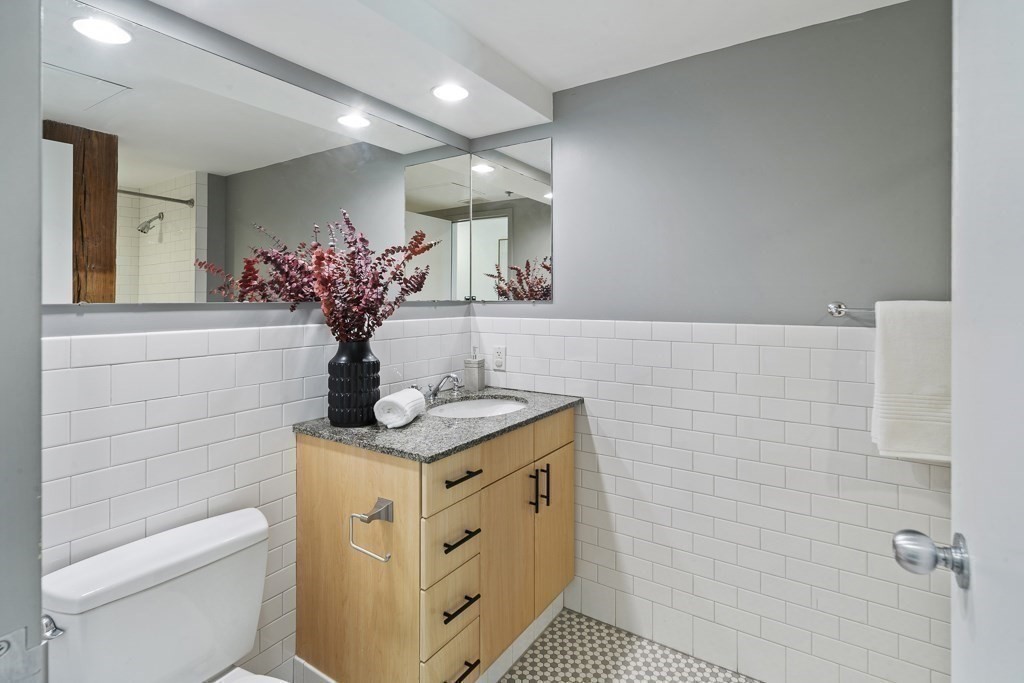 9 West Broadway, Unit 312 Boston, MA 02127 - Photo 21 of 35 a bath room with a sink and a toilet