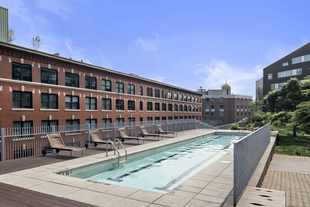 9 West Broadway, Unit 312 Boston, MA 02127 - Photo 27 of 35 a view of a patio with a table and chairs