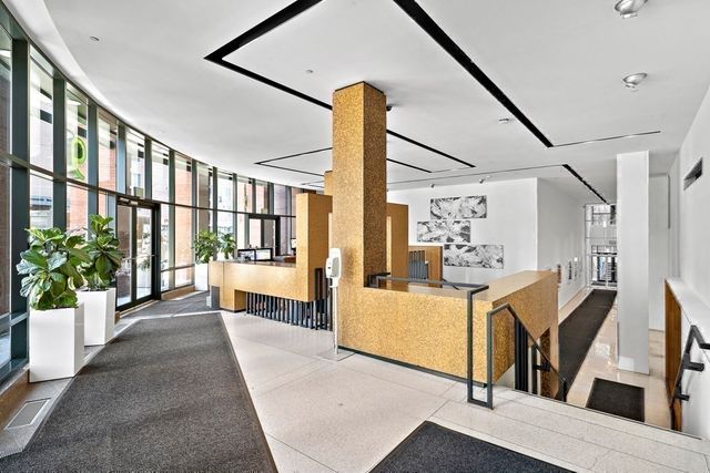 a view of living room with furniture and window
