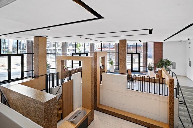 a view of staircase with furniture and floor to ceiling window