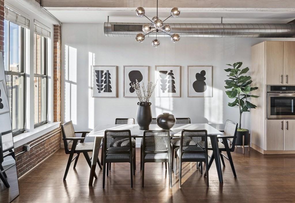 9 West Broadway, Unit 312 Boston, MA 02127 - Photo 5 of 35 a view of a dining room with furniture window and wooden floor