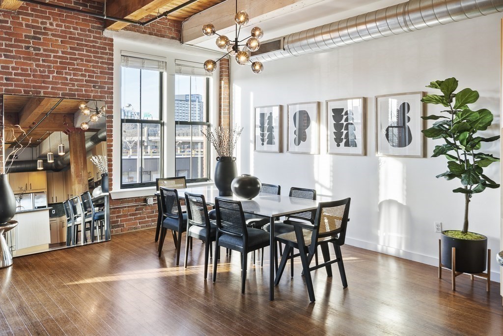 9 West Broadway, Unit 312 Boston, MA 02127 - Photo 6 of 35 a view of a dining room with furniture window and wooden floor