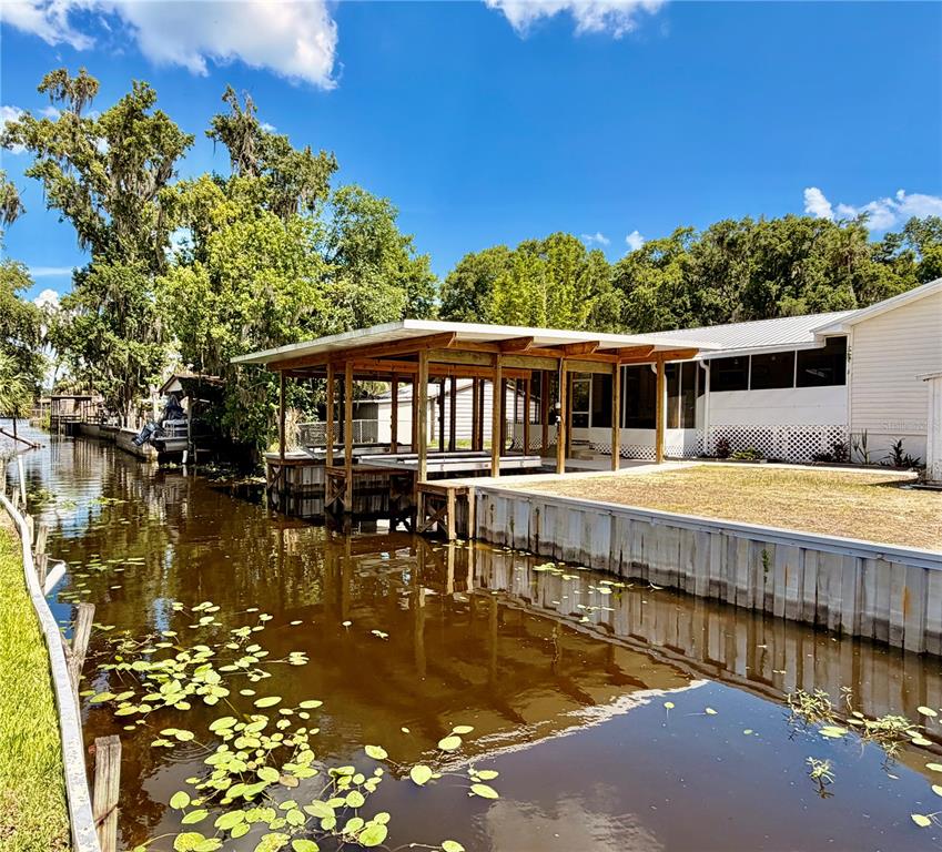 24521 Alligator Road Astor, FL 32102 - Photo 48 of 51 a swimming pool view with a outdoor seating