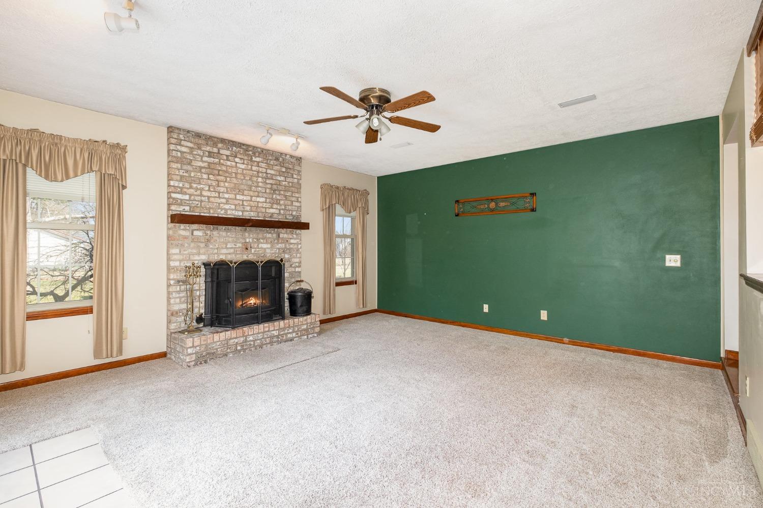 9728 Baughman Road Harrison, OH 45030 - Photo 10 of 56 Living room WBFP with insert. Bonus shed full of wood in back yard.