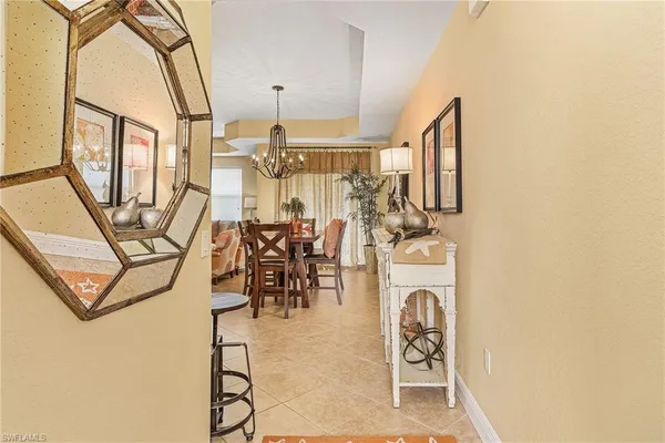 a view of a hallway with furniture and entryway