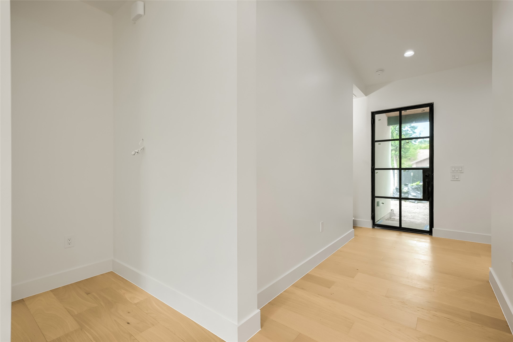 4603 Bucks Run Austin, TX 78744 - Photo 18 of 20 Clean lines and warm hardwood floors define this welcoming entry hallway.