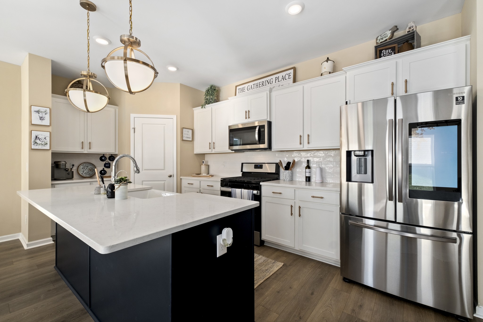 426 Butler Road Mount Juliet, TN 37122 - Photo 12 of 41 a kitchen with a refrigerator a sink and dishwasher a stove with wooden floor