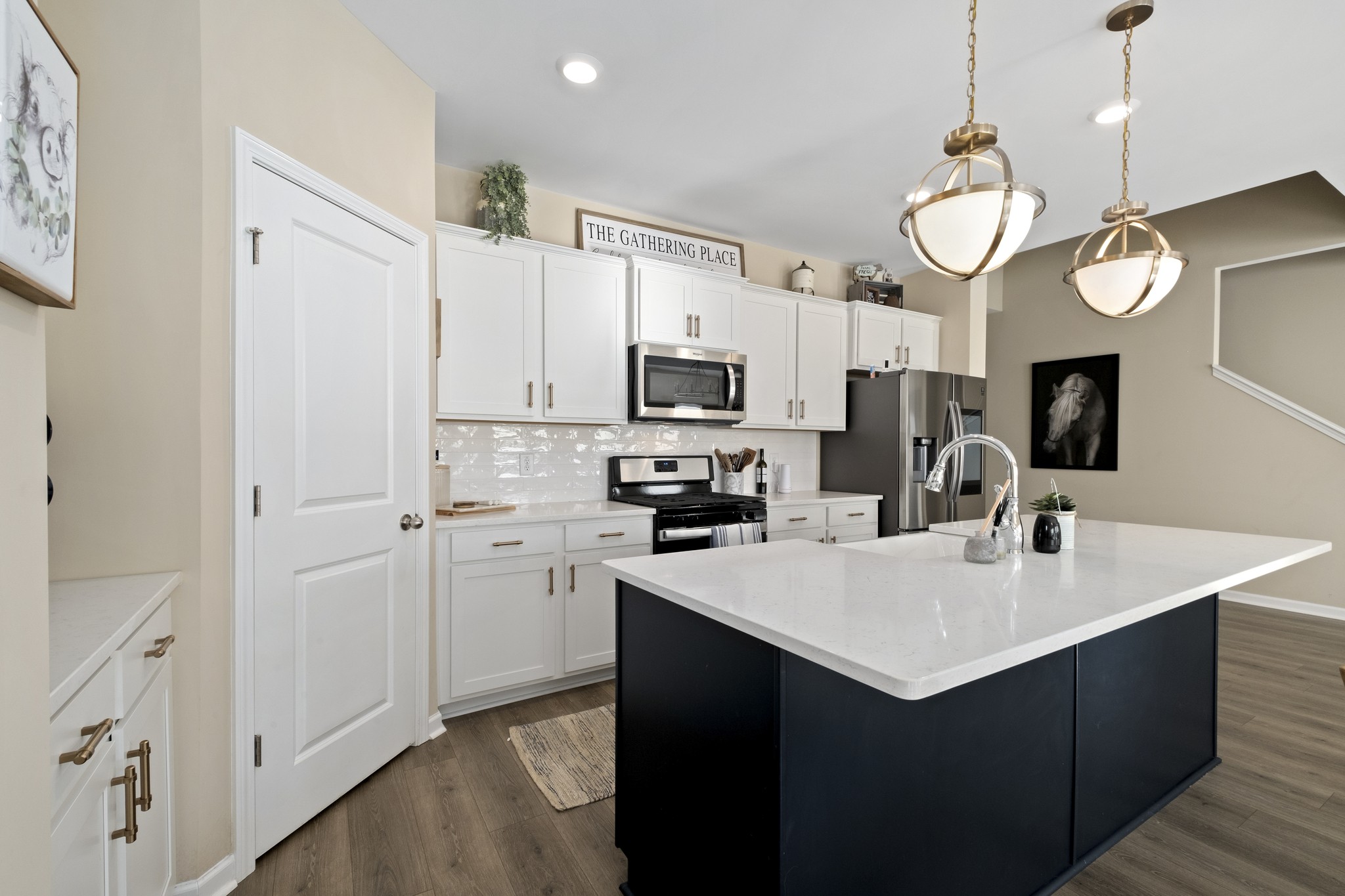 426 Butler Road Mount Juliet, TN 37122 - Photo 13 of 41 a kitchen with a sink stainless steel appliances a large window and cabinets