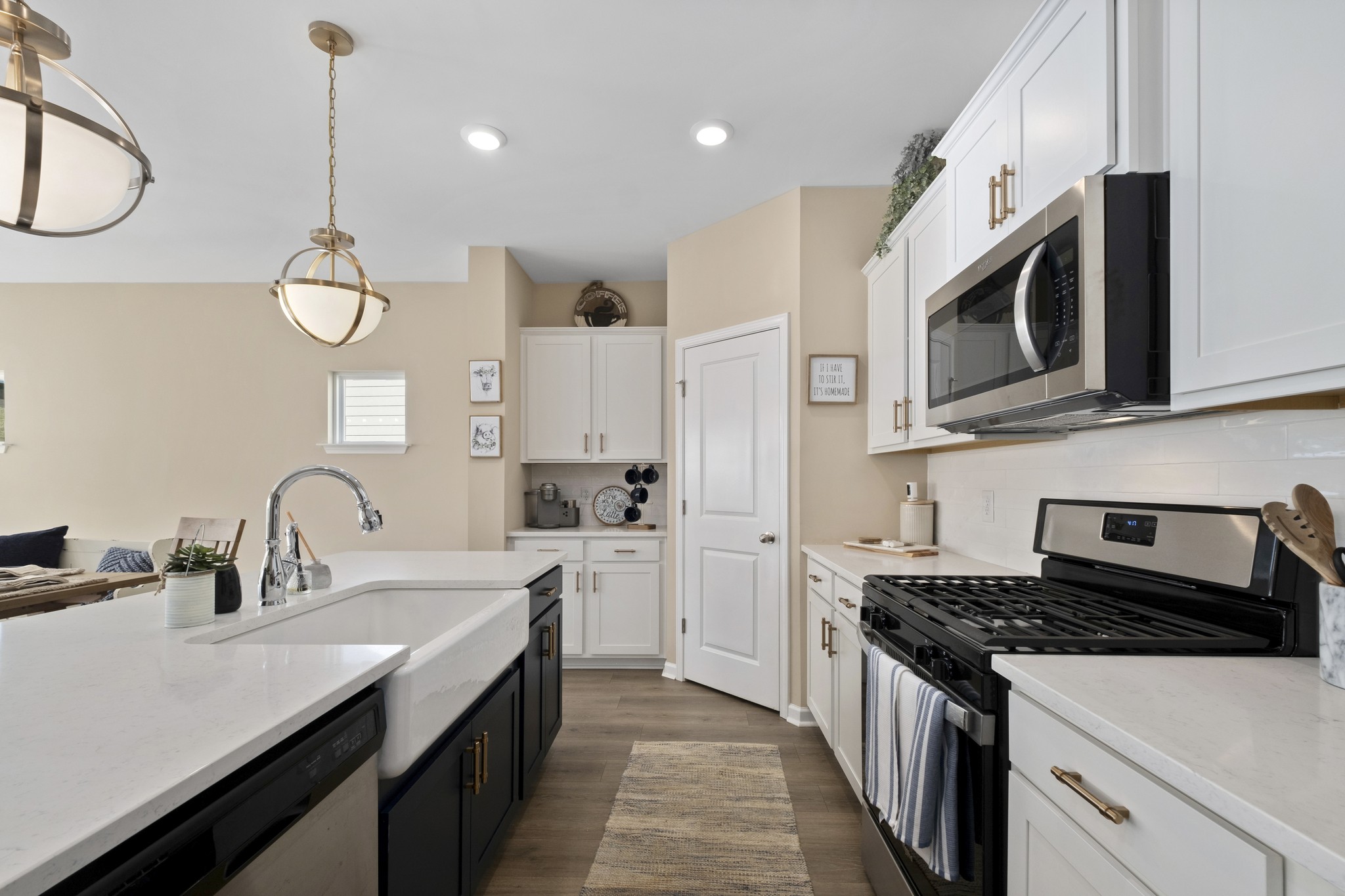 426 Butler Road Mount Juliet, TN 37122 - Photo 14 of 41 a kitchen with stainless steel appliances granite countertop a sink a stove and a wooden floors