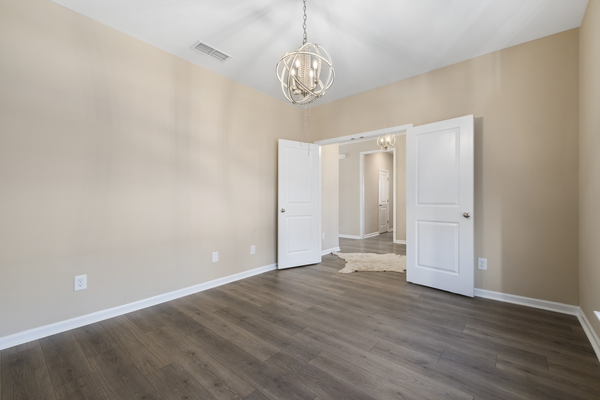 426 Butler Road Mount Juliet, TN 37122 - Photo 6 of 41 a view of an empty room with wooden floor and a window
