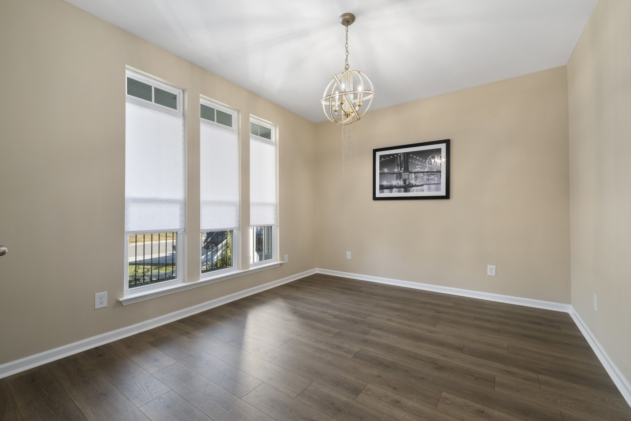 426 Butler Road Mount Juliet, TN 37122 - Photo 7 of 41 a view of an empty room with wooden floor and a window