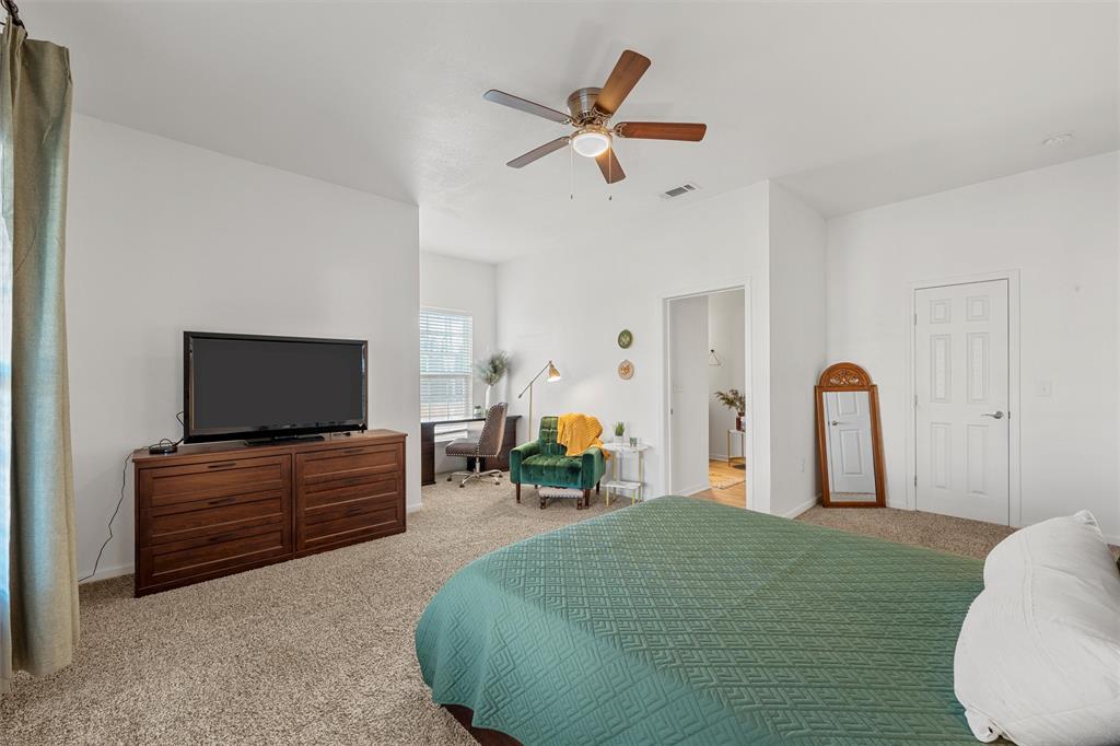 1200 North 15th Street Waco, TX 76707 - Photo 10 of 19 a bed room with furniture and a flat screen tv