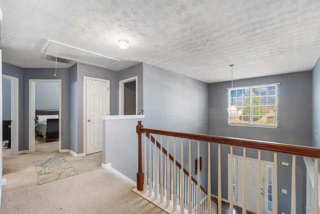 a view of a hallway with windows