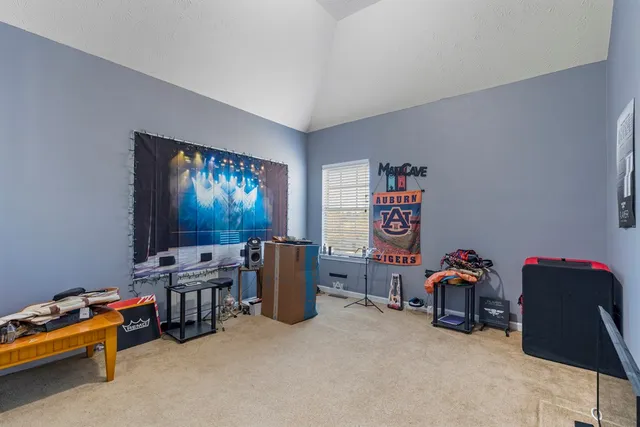 a room with furniture and a flat screen tv