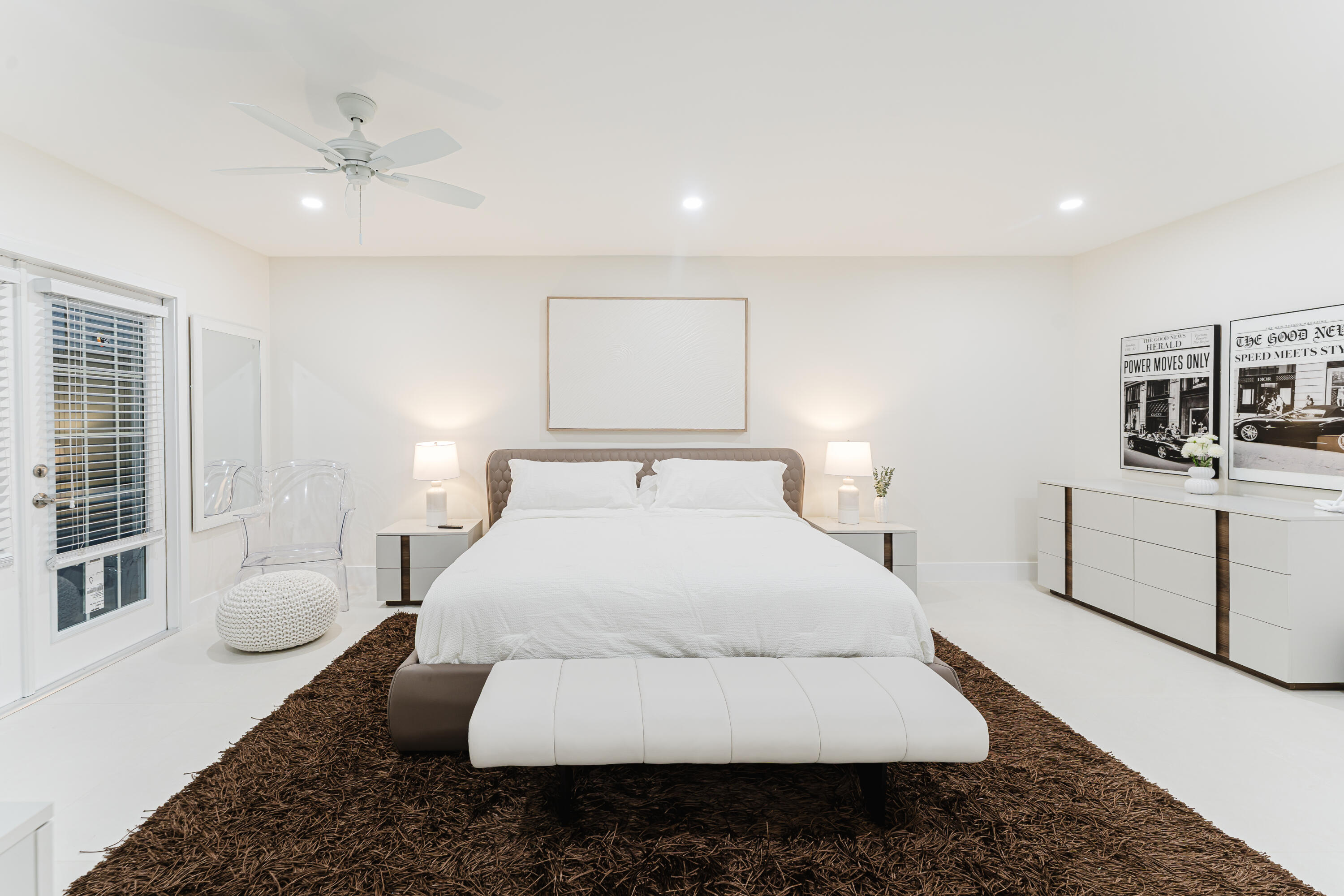 3199 Northeast 6th Drive Boca Raton, FL 33431 - Photo 31 of 49 a bed room with a bed and a couch