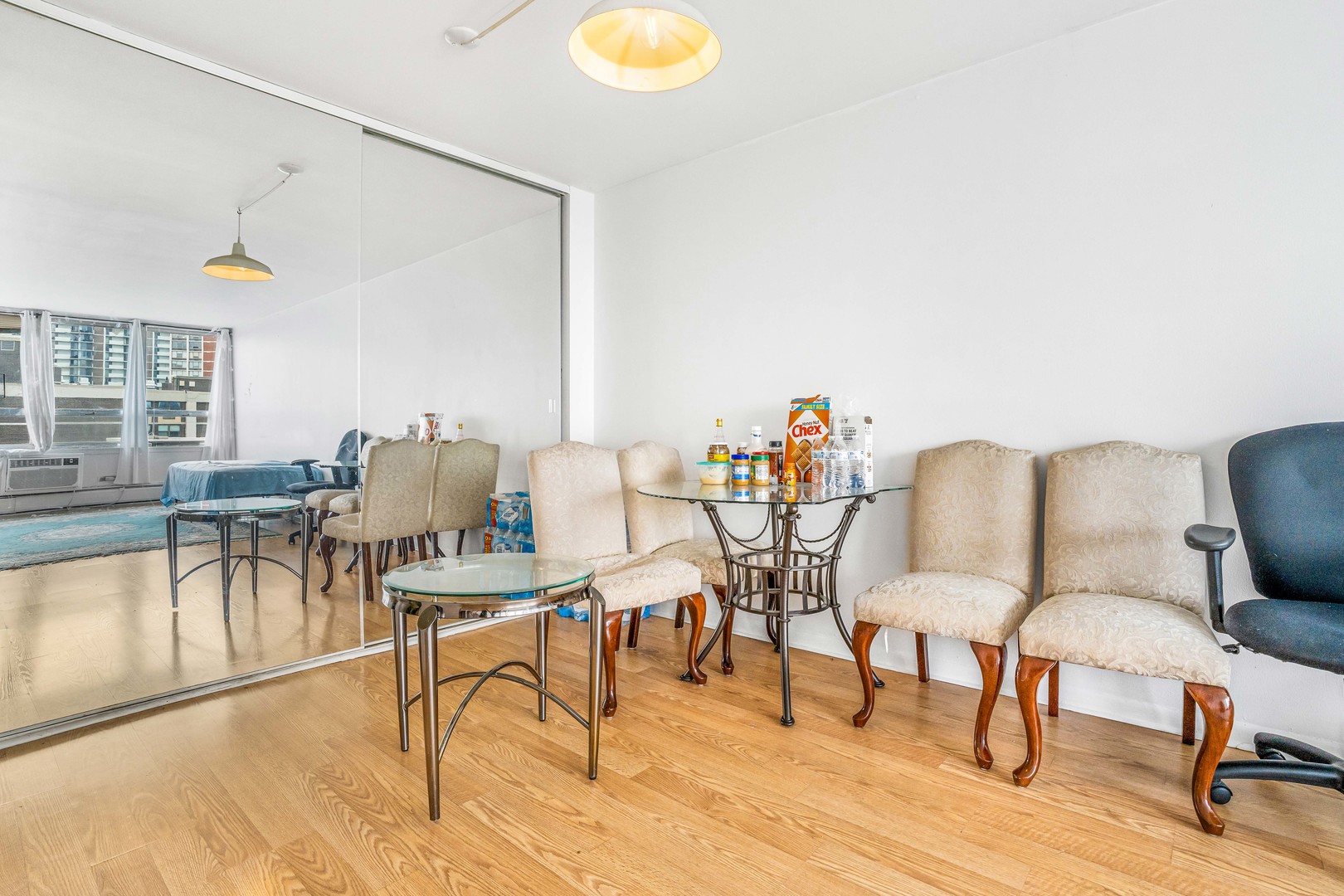 6171 North Sheridan Road, Unit 2804 Chicago, IL 60660 - Photo 6 of 27 a workspace with furniture and wooden floor