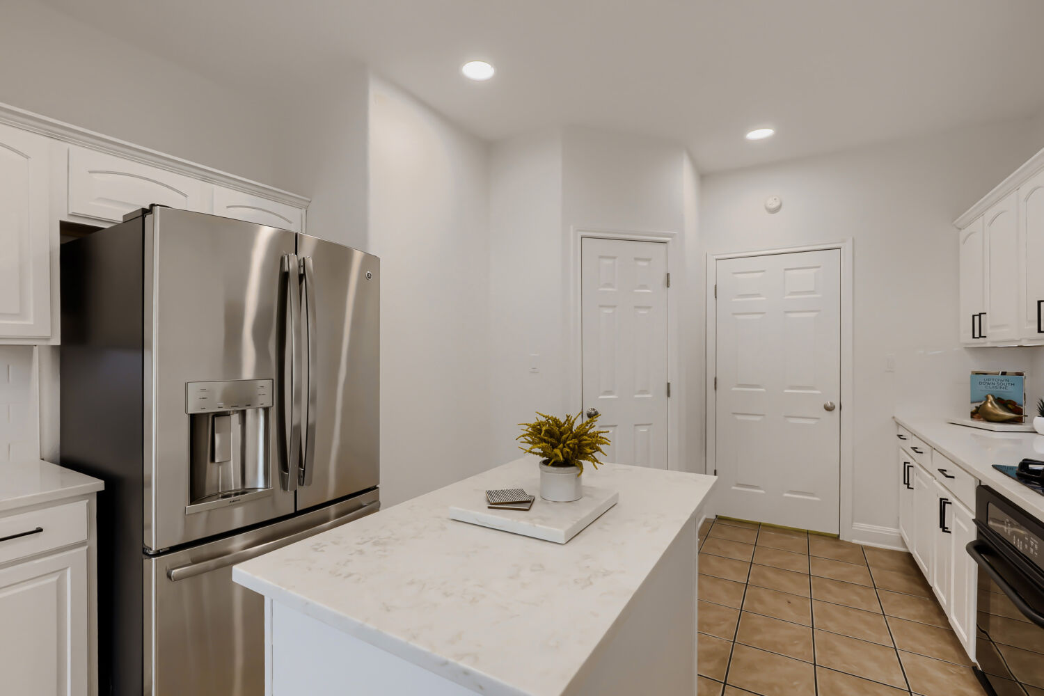 112 Aria Ridge Austin, TX 78738 - Photo 12 of 30 a kitchen with stainless steel appliances a refrigerator and a stove