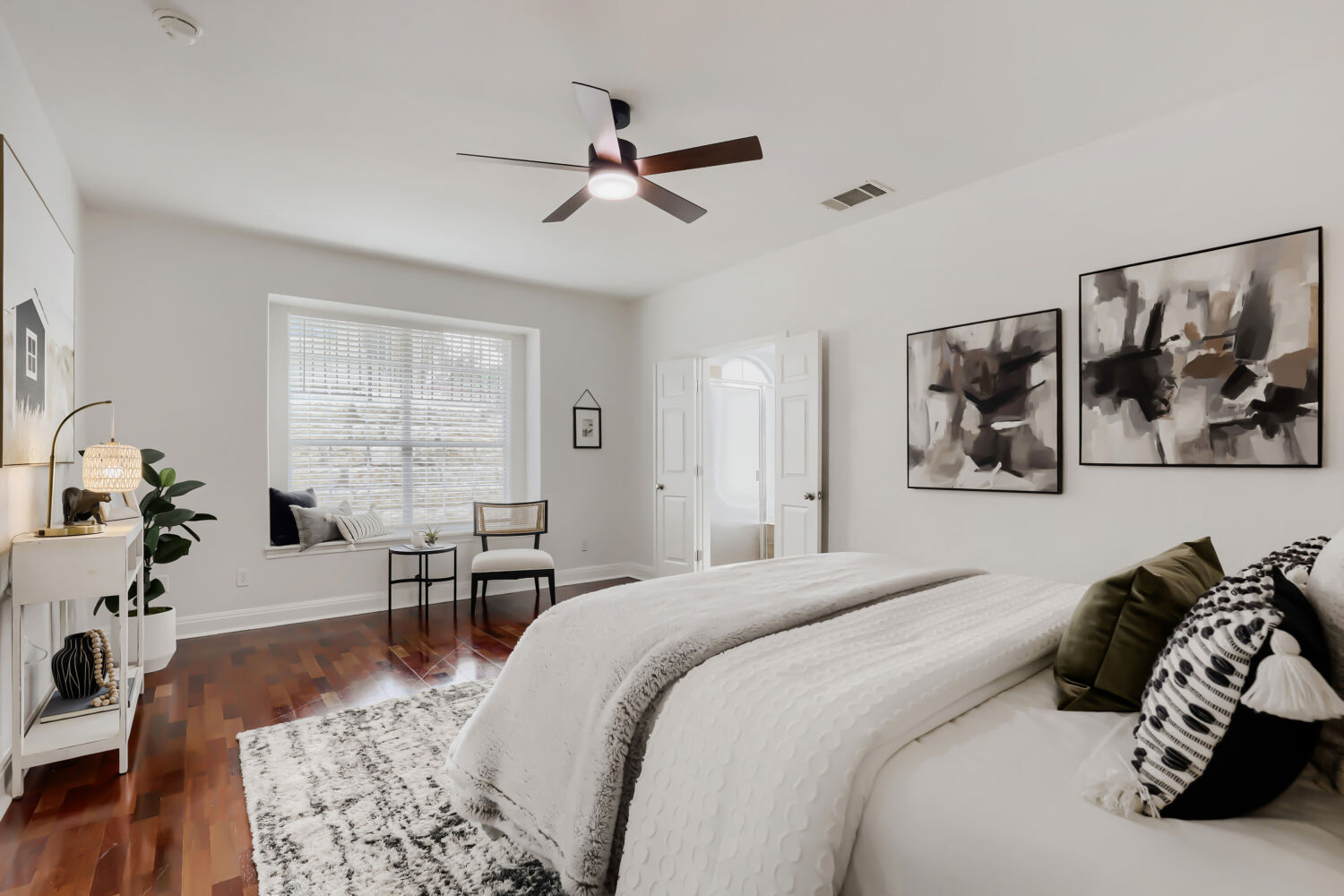 112 Aria Ridge Austin, TX 78738 - Photo 13 of 30 a bedroom with a bed and wooden floor