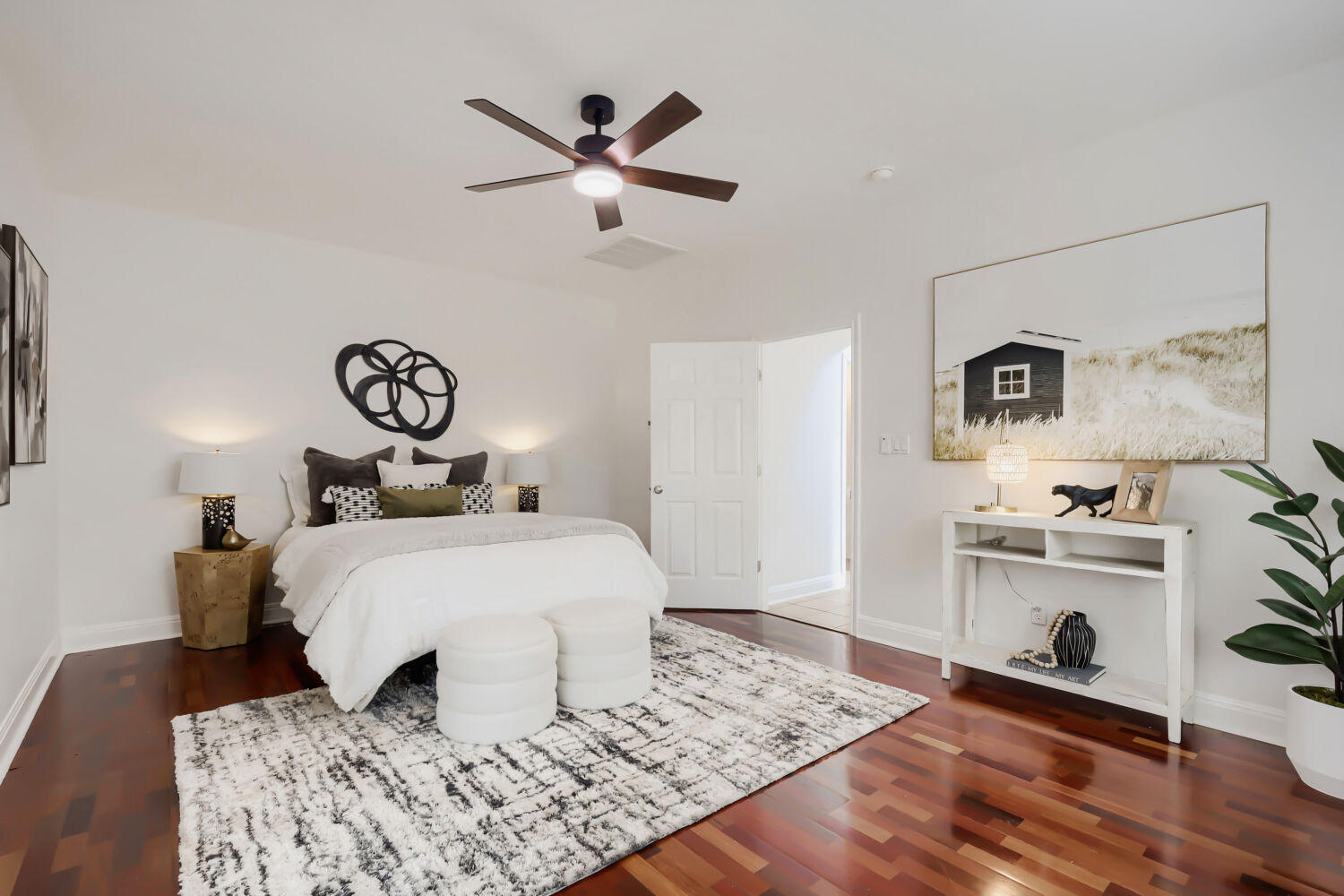 112 Aria Ridge Austin, TX 78738 - Photo 14 of 30 a bedroom with a bed and a chandelier