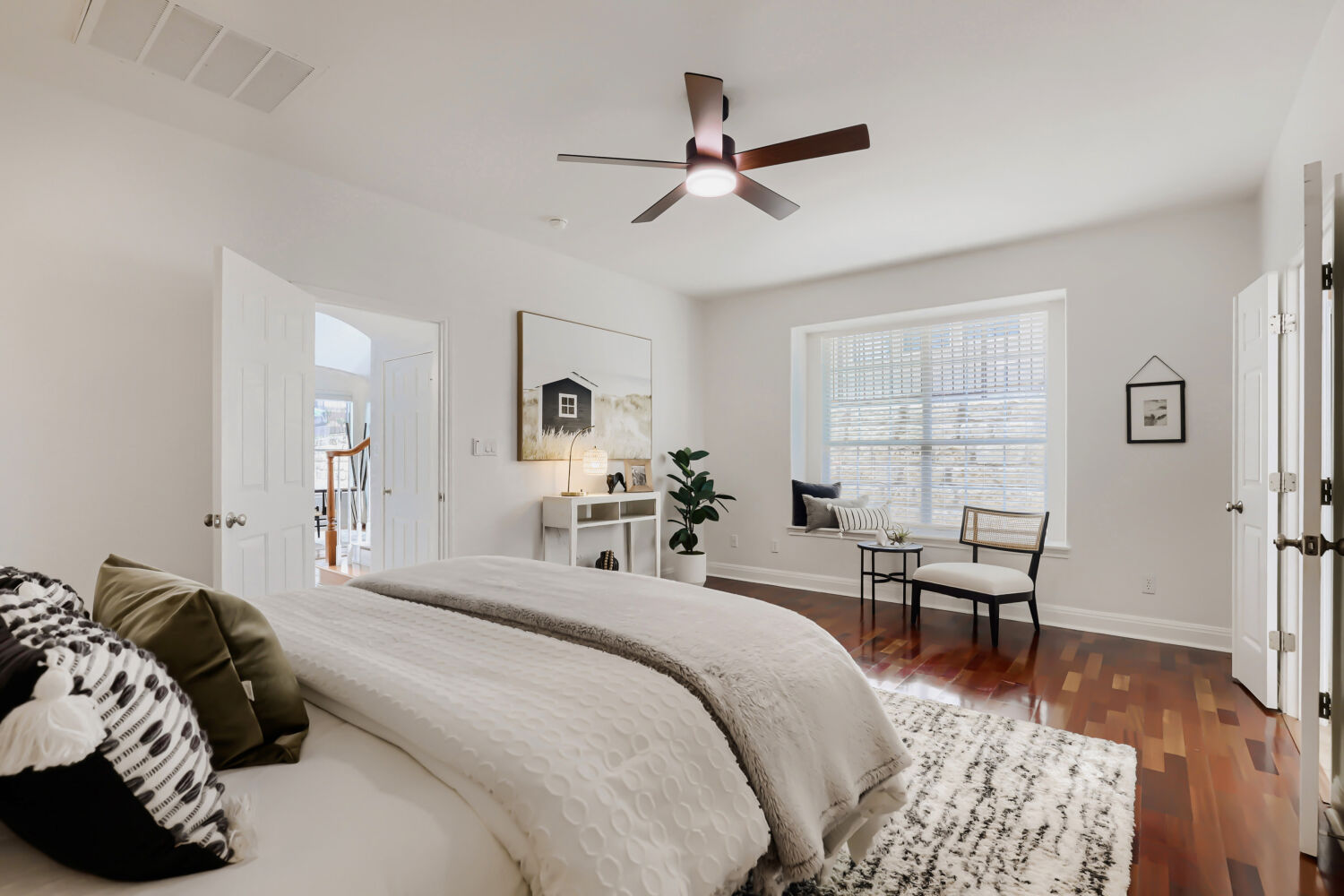 112 Aria Ridge Austin, TX 78738 - Photo 15 of 30 a bedroom with a bed and wooden floor