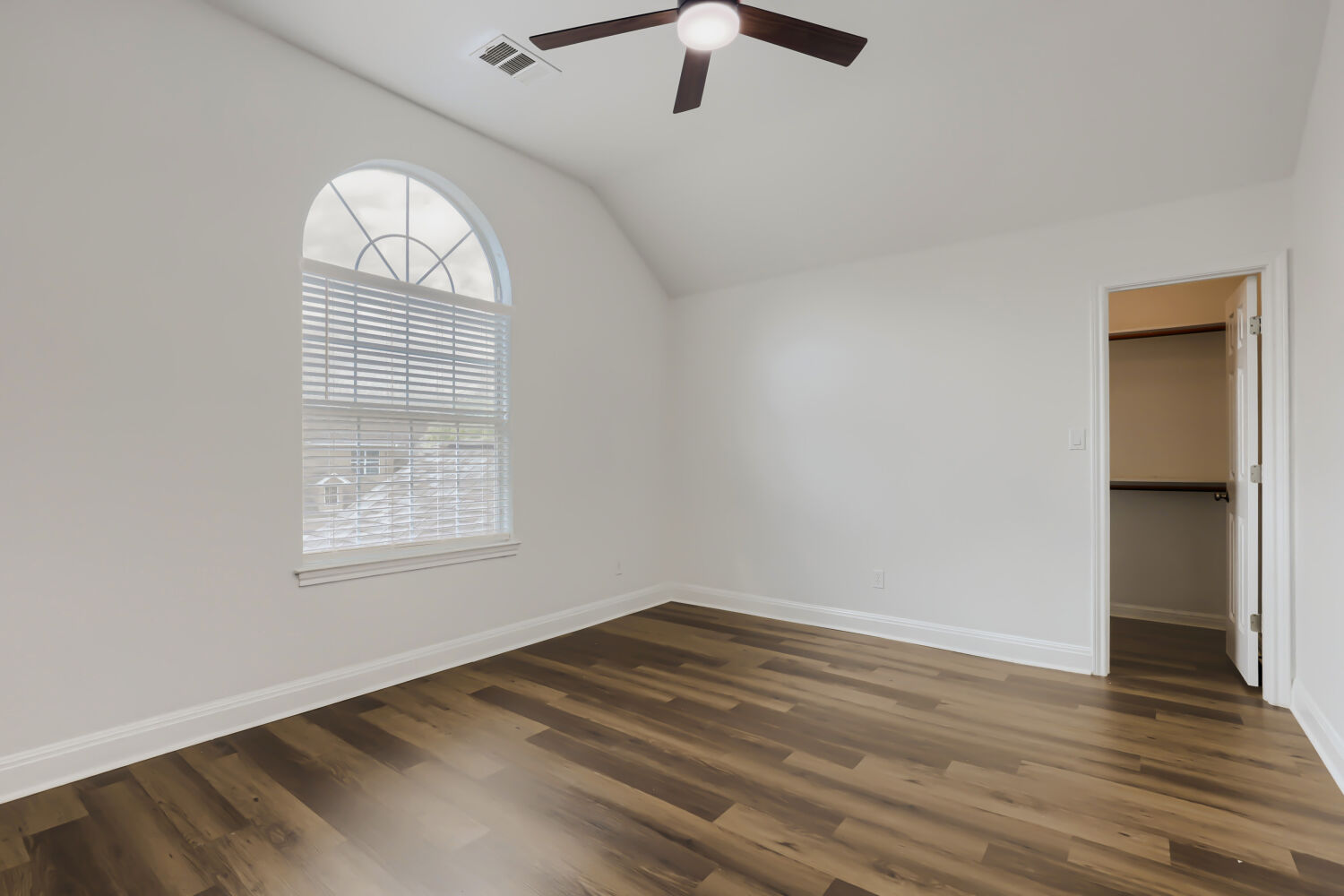 112 Aria Ridge Austin, TX 78738 - Photo 17 of 30 an empty room with wooden floor cabinet and windows