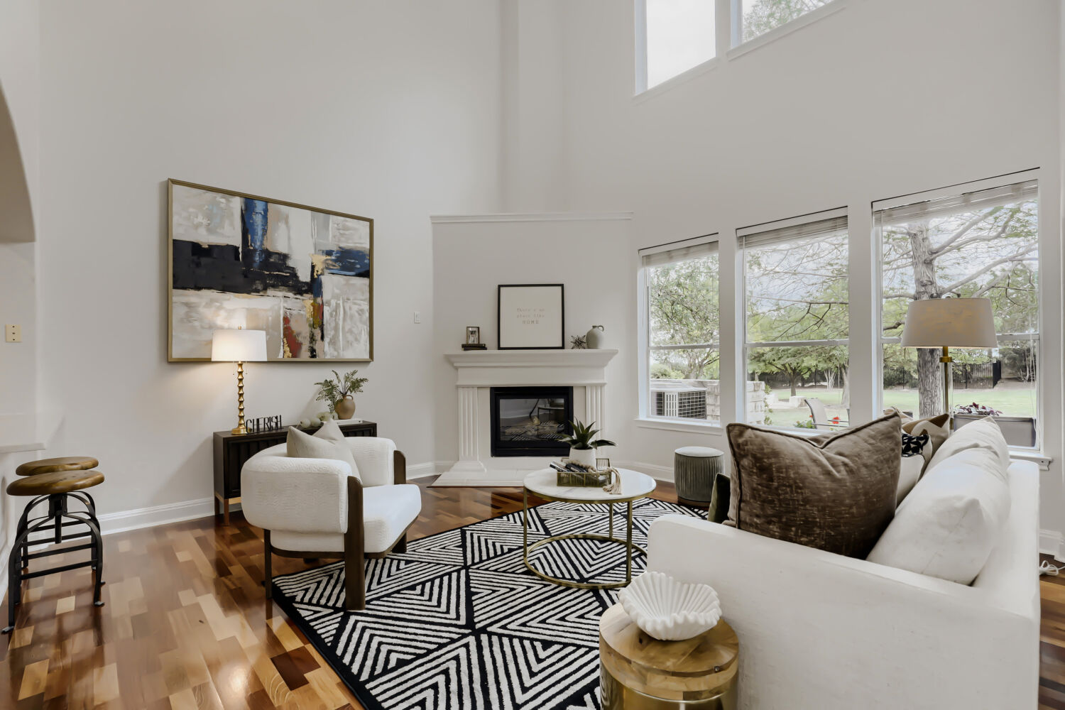 112 Aria Ridge Austin, TX 78738 - Photo 2 of 30 a living room with furniture a table and a fireplace