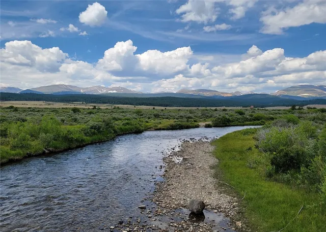 a view of a yard with an outdoor seating