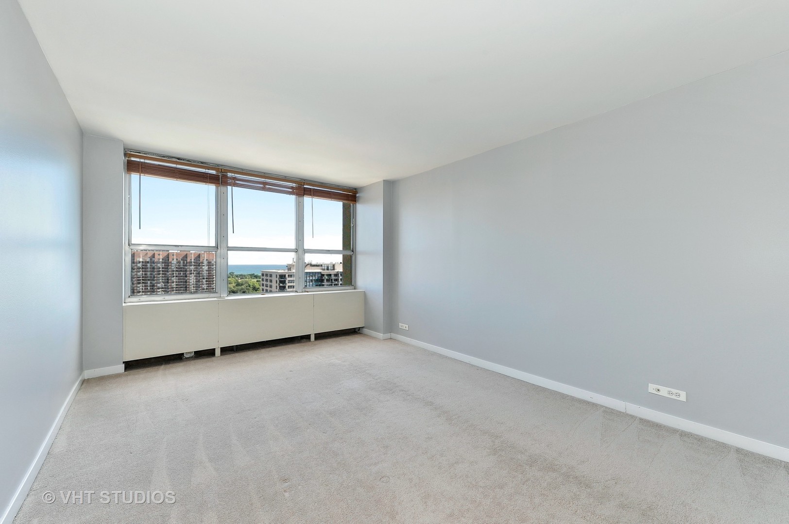 655 West Irving Park Road, Unit 2106 Chicago, IL 60613 - Photo 13 of 15 a view of an empty room with a window