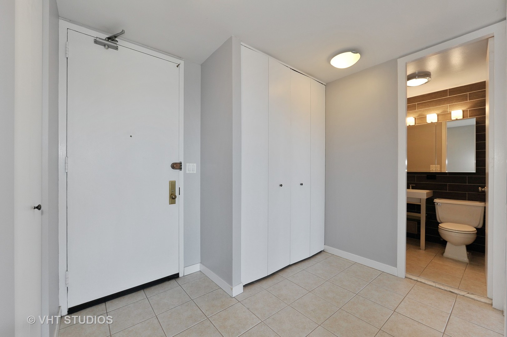 655 West Irving Park Road, Unit 2106 Chicago, IL 60613 - Photo 3 of 15 a view of a hallway with bathroom and bathroom