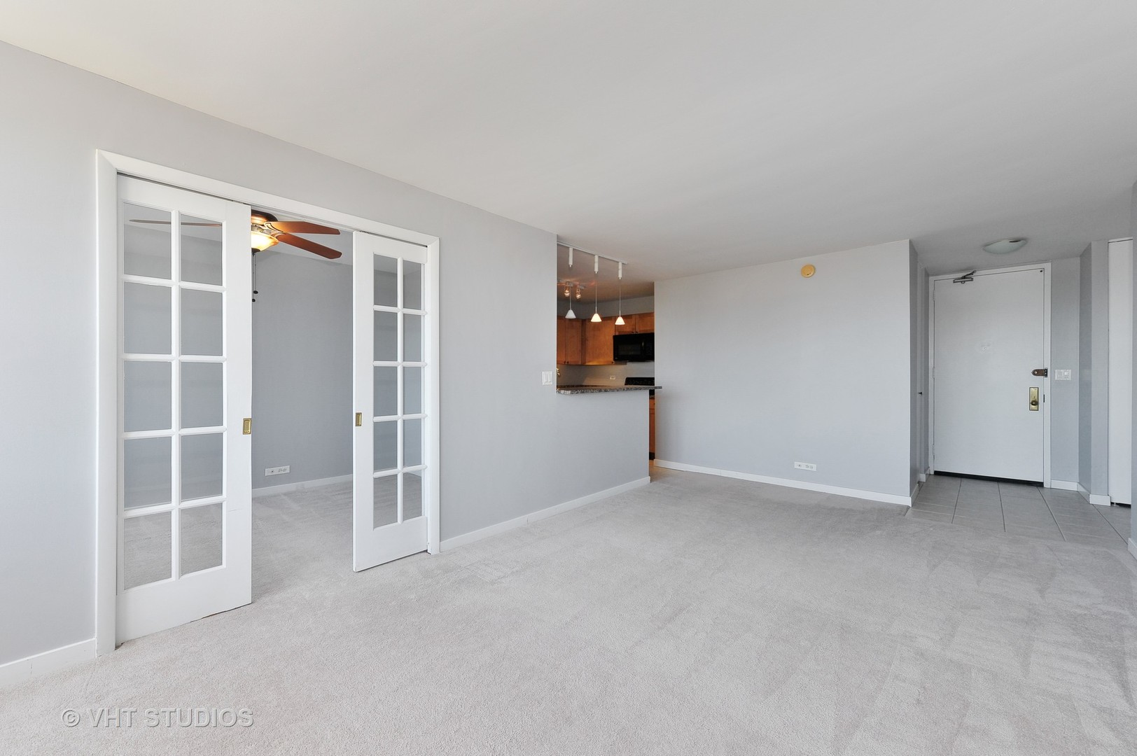 655 West Irving Park Road, Unit 2106 Chicago, IL 60613 - Photo 7 of 15 an empty room with a empty space and windows