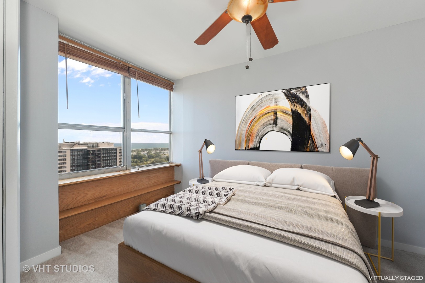 655 West Irving Park Road, Unit 2106 Chicago, IL 60613 - Photo 10 of 15 a bedroom with a large bed and a window