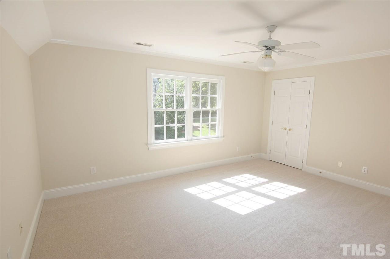 8708 Bell Grove Way Raleigh, NC 27615 - Photo 22 of 25 an empty room with windows