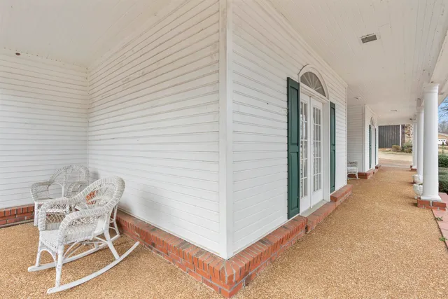 a view of a hallway with seating area
