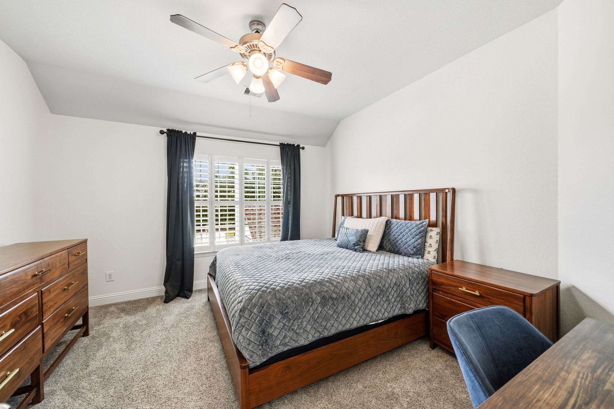 17610 Strackfield Lane Tomball, TX 77377 - Photo 35 of 50 Located just off the landing, the third bedroom feels both private and welcoming, with a tray ceiling adding architectural charm and soft carpet enhancing everyday comfort.
