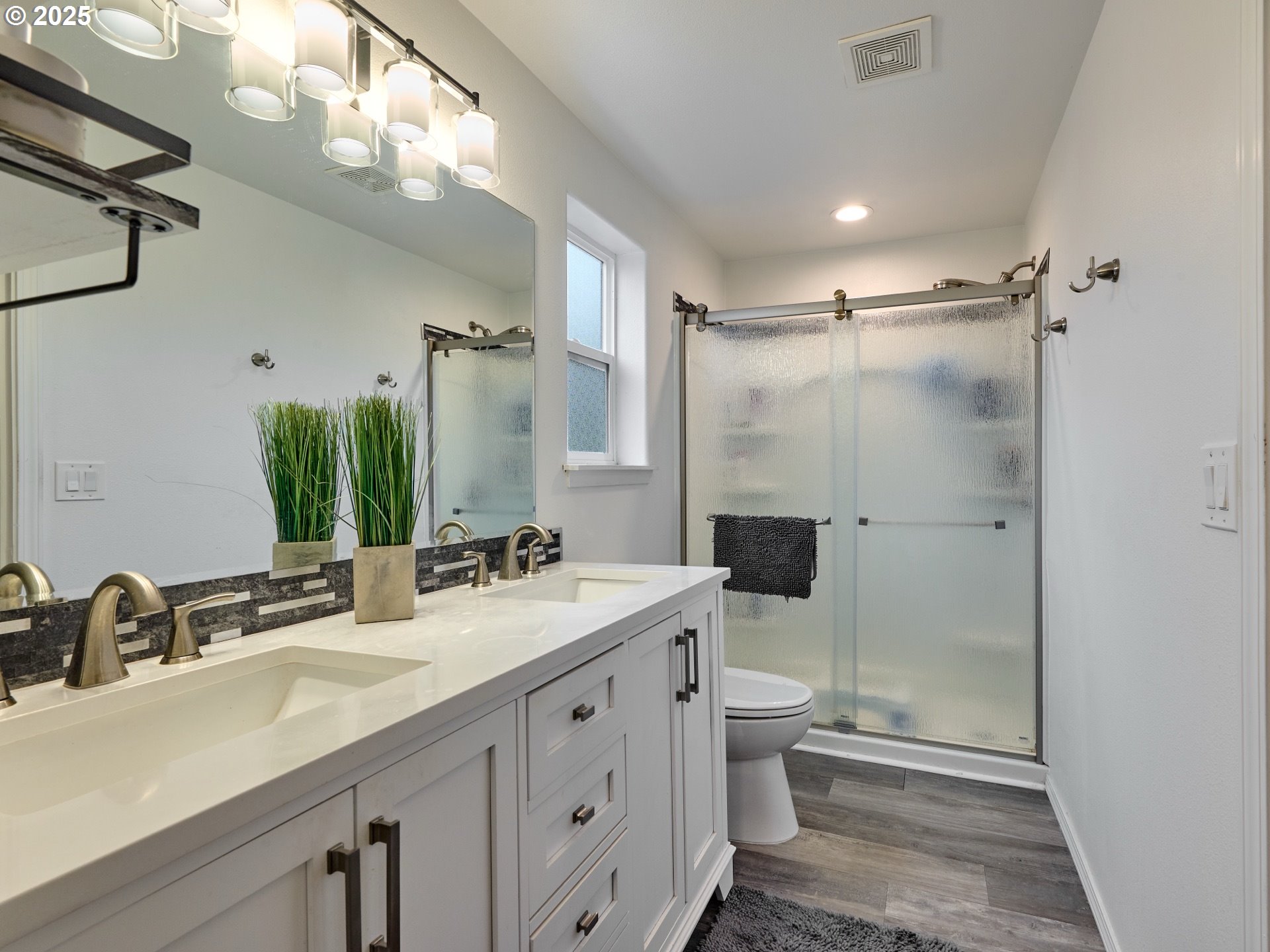 1353 Jodi Drive Silverton, OR 97381 - Photo 22 of 48 a bathroom with a double vanity sink toilet and shower