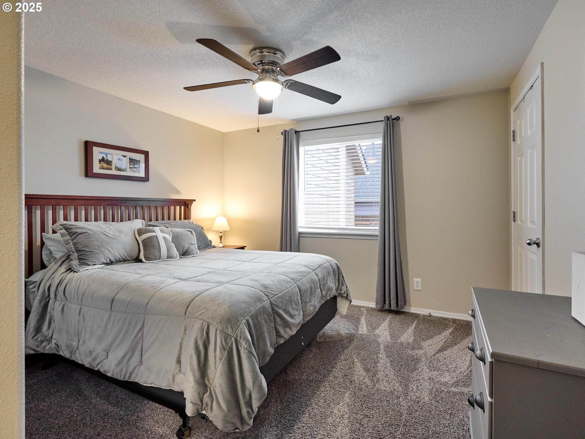 1353 Jodi Drive Silverton, OR 97381 - Photo 23 of 48 a bedroom with a large bed and a window